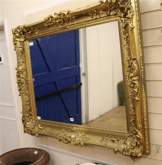 A large gilt gesso picture framed wall mirror, W.118cm